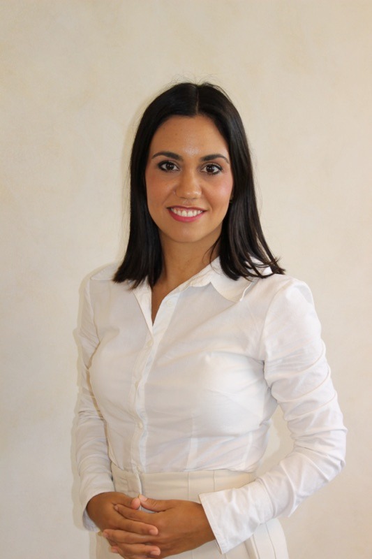 Smiling woman in white shirt