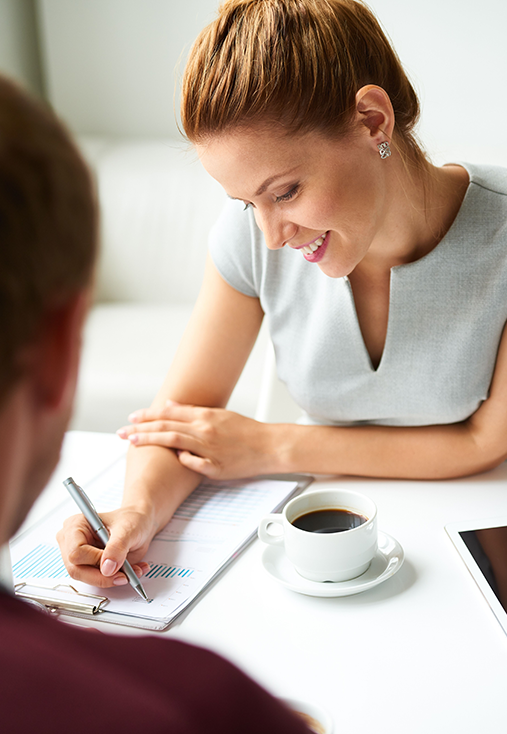 Smiling woman reviewing documents